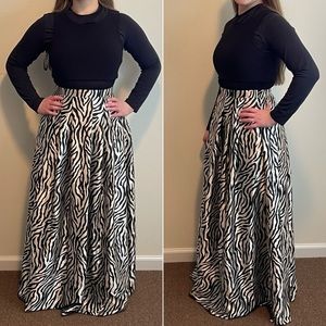 Stunning sleeveless floor length zebra print gown. Perfect formal wear.